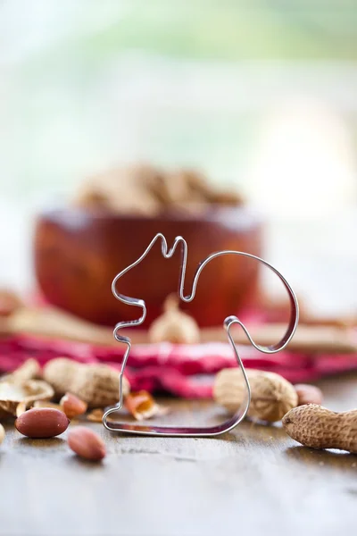 A wooden bowl full of peanuts — Stock Photo, Image