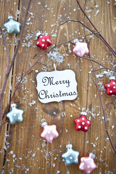 Christmas ornaments and seasonal greetings — Stock Photo, Image