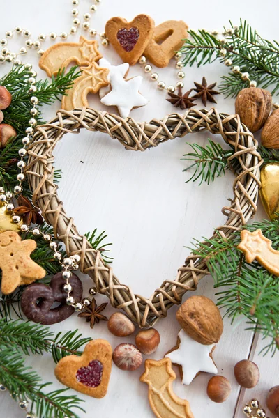Seasonal Greetings with christmas cookies and nuts — Stock Photo, Image