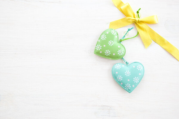 White wooden background with decorative hearts