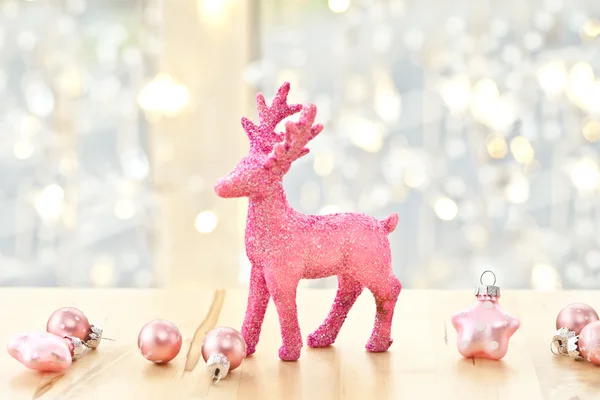 Pink deer and christmas decorations — Stock Photo, Image