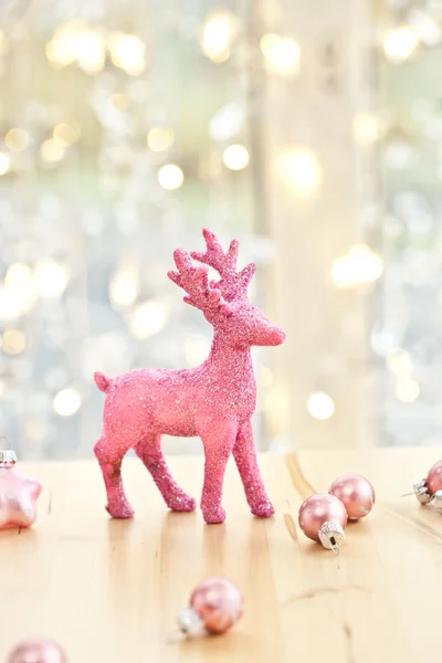 Pink deer and christmas decorations — Stock Photo, Image