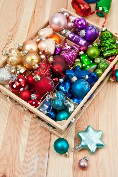 Little box with christmas baubles — Stock Photo, Image