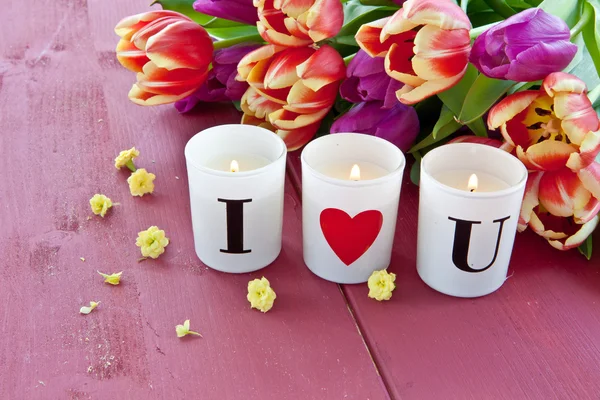 Fresh tulips and candles — Stock Photo, Image