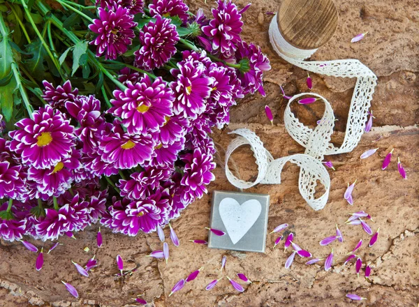 Fresh flowers on wooden background — Stock Photo, Image