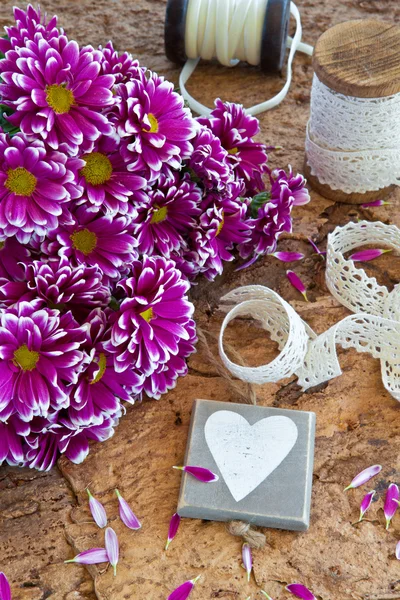 Fresh flowers on wooden background — Stock Photo, Image