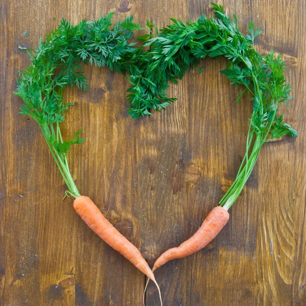 Fresh carrots with green leaves — Stock Photo, Image