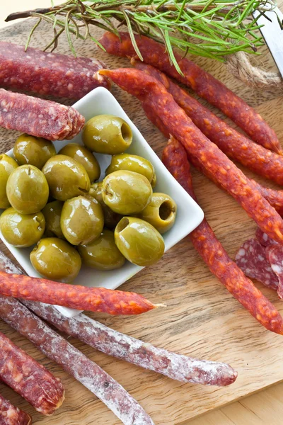 Antipasti with salami and olives — Stock Photo, Image