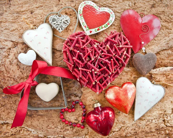 Various hearts on wooden bark — Stock Photo, Image