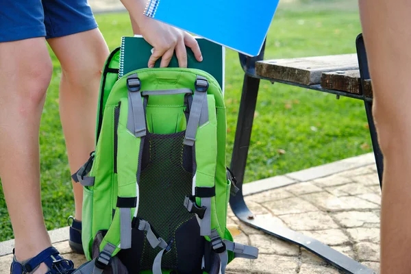 Close School Boy Putting His File Folder Homework Exercises Backpack — Foto de Stock