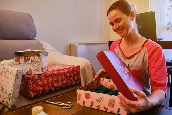 A Woman packing box of present