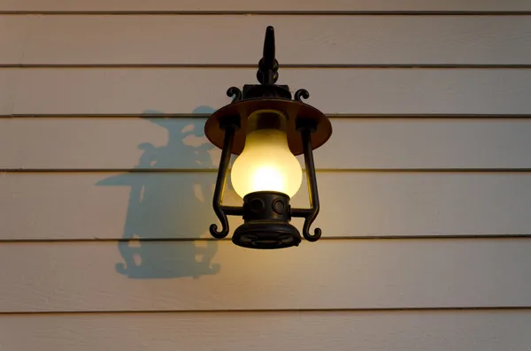 Lamp on the plank wall — Stock Photo, Image