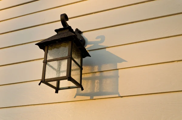 Lamp on the plank wall — Stock Photo, Image