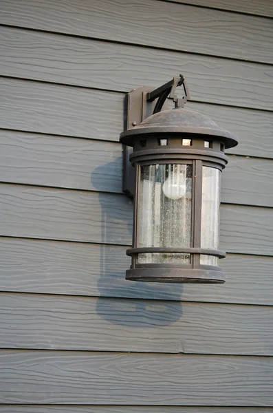 Lamp on the plank wall — Stock Photo, Image