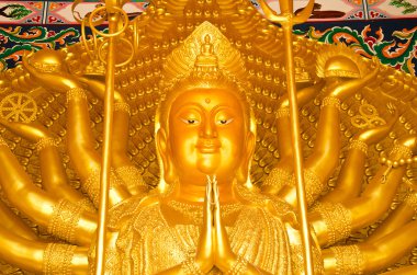 Golden statue of Thousand-Hand Quan Yin Bodhisattva clipart