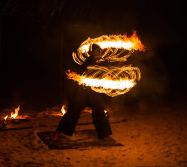 Fire show on the beach at night in Phuket, Thailand