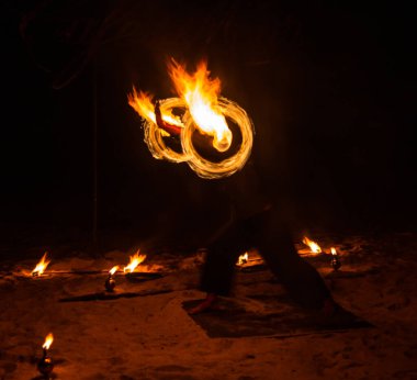 Fire show on the beach at night in Phuket, Thailand