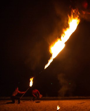 Fire show on the beach at night in Phuket, Thailand