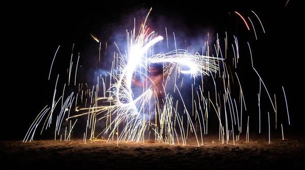 Fire show on the beach at night in Phuket, Thailand — стоковое фото