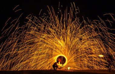 Fire show on the beach at night in Phuket, Thailand