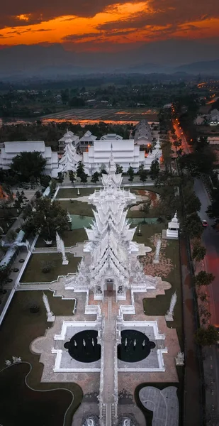 Aerial view of Wat Rong Khun, the white temple, at sunrise, in Chiang Rai, Thailand Stock Photo