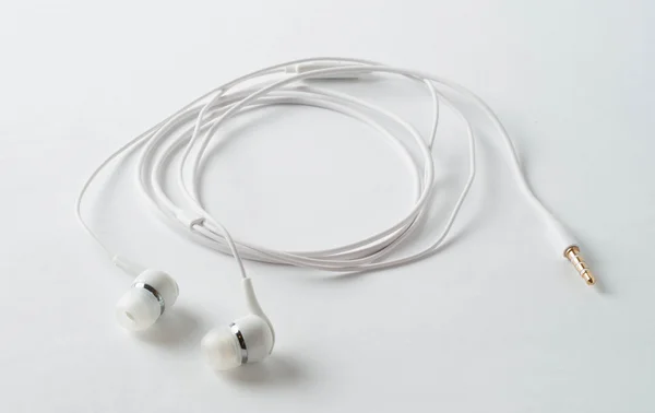 Bílá sluchátka — Stock fotografie