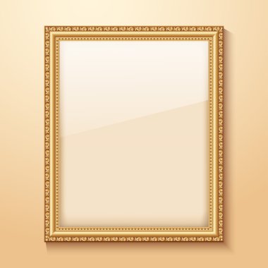 Empty gold frame hanging on the wall.