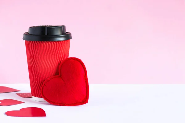 Red cup of coffee, red heart, Valentine's Day greeting card with copy space for text. Romance, love concept