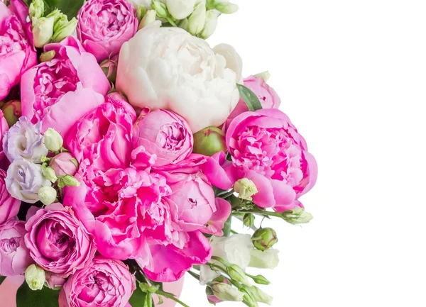 Arrangement of flowers in a hat box. Bouquet of pink and white peonies, eustoma, spray rose in a pink box with an oasis isolated on a white background with copy space