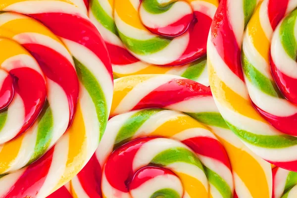 圆形棒棒糖的背景纹理摘要 彩虹色的糖果和糖果背景 — 图库照片