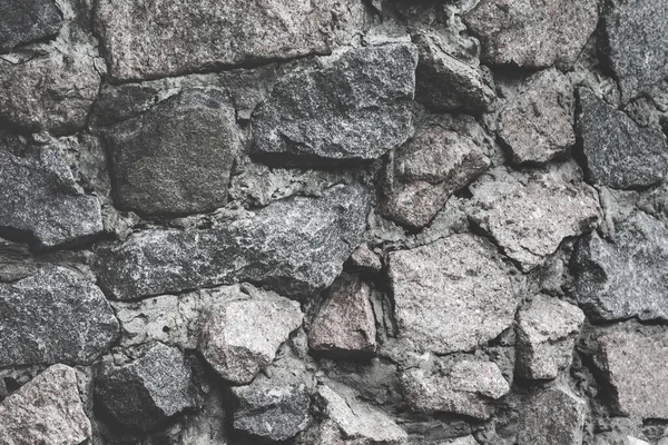 Seamless masonry stone wall texture. Wallpapaper background. stone close up. Volumetric texture of a rough large stone