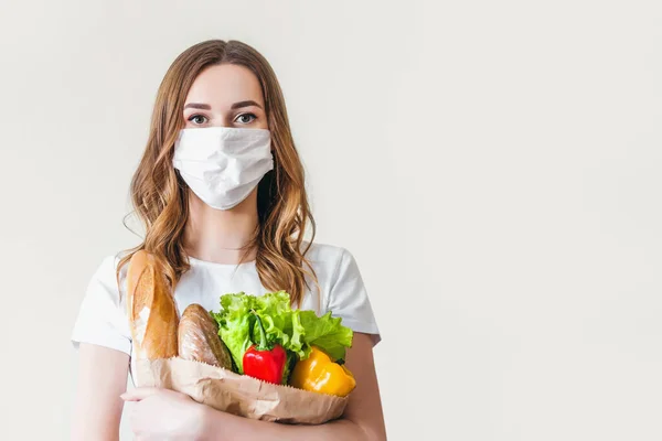 Young Woman Medical Mask Holds Paper Bag Food Fruits Vegetables — Stok fotoğraf