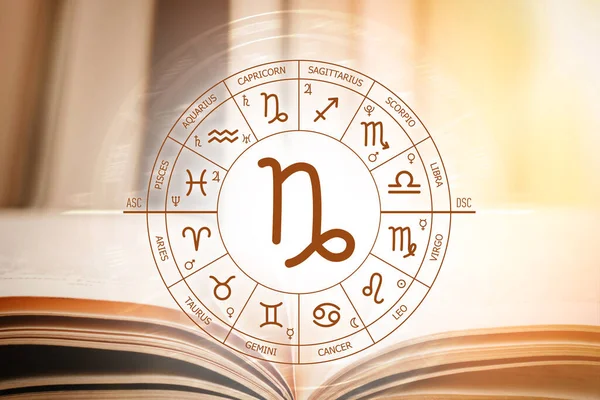Zodiac circle against the background of an open book with Sagittarius sign. Astrological forecast for the signs of the zodiac. Characteristics of the sign Sagittarius. Astrology, esotericism, secret science