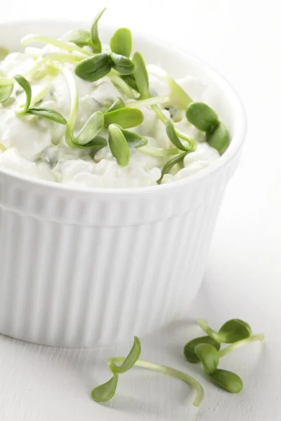 Cottage cheese with herbs and fresh sunflower sprouts. — Stock Photo, Image