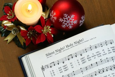 Detail of songbook with christmas carols clipart