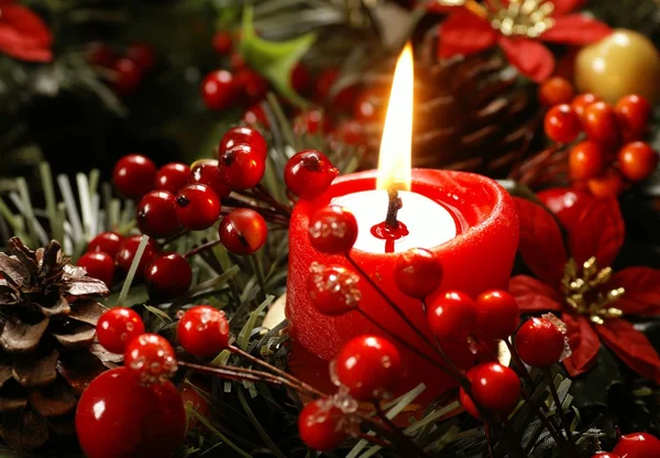 Red candle and christmas decorations — Stok fotoğraf