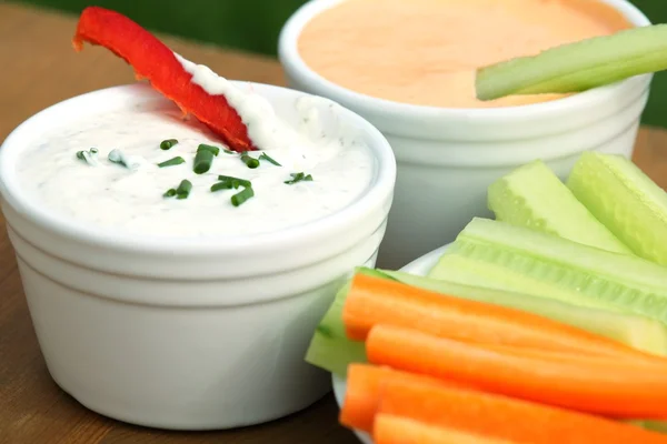 Vegetable sticks and dips in bowls — Stock Photo, Image