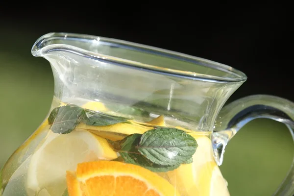 Detail of jug with fresh lemonade outdoor in summer day — Stock Photo, Image