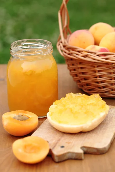 Glass with apricot jam — Stock Photo, Image