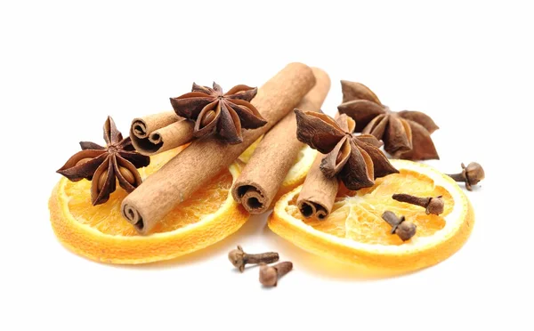 Dry orange slices, cinnamon sticks, anise and clove — Stock Photo, Image