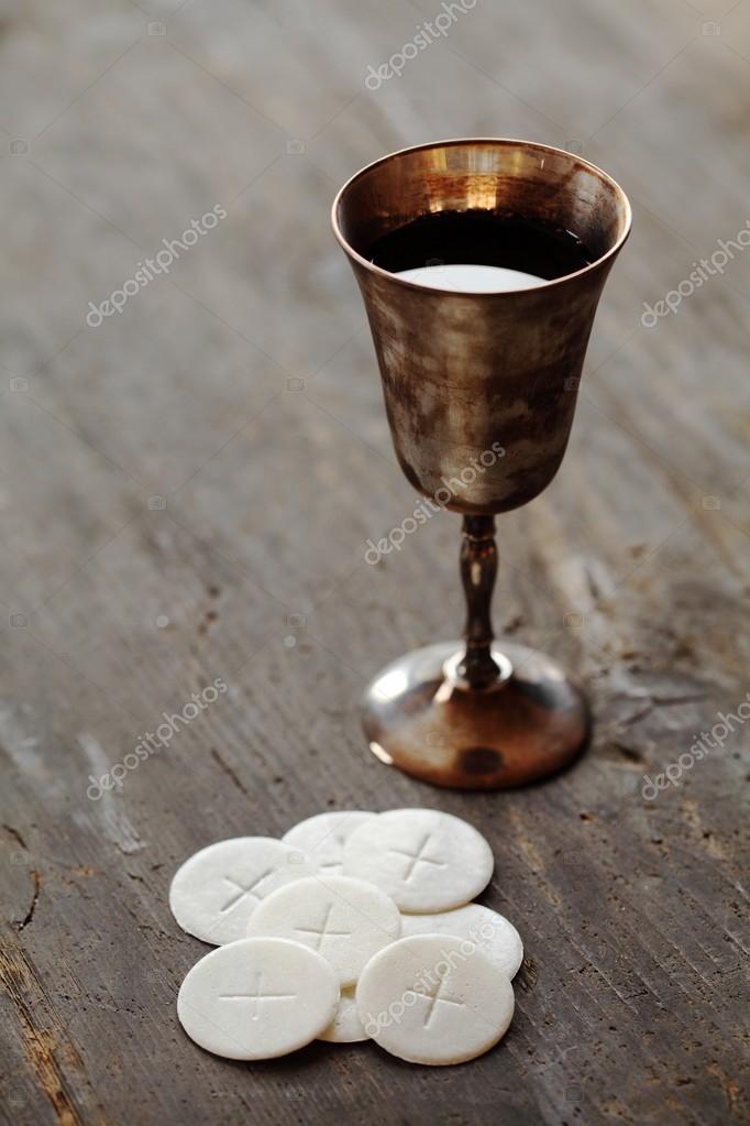 Chalice with wine and communion wafers Stock Photo by ©MKucova 26421611