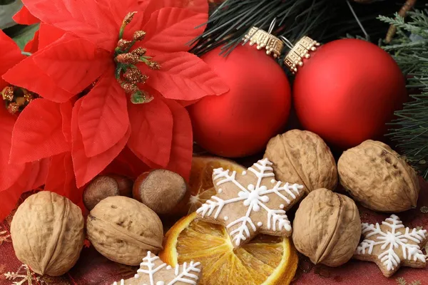 Christmas decorations, nuts and gingerbread cookies. Stock Photo