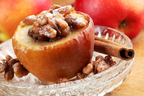 Baked apple stuffed with raisins and nuts. — Stock Photo, Image