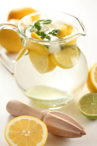 Jug of fresh lemonade with mint leaves — Stock Photo, Image