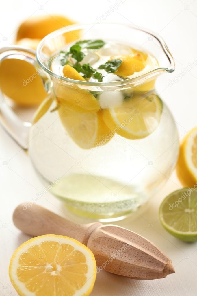 Jug of fresh lemonade with mint leaves