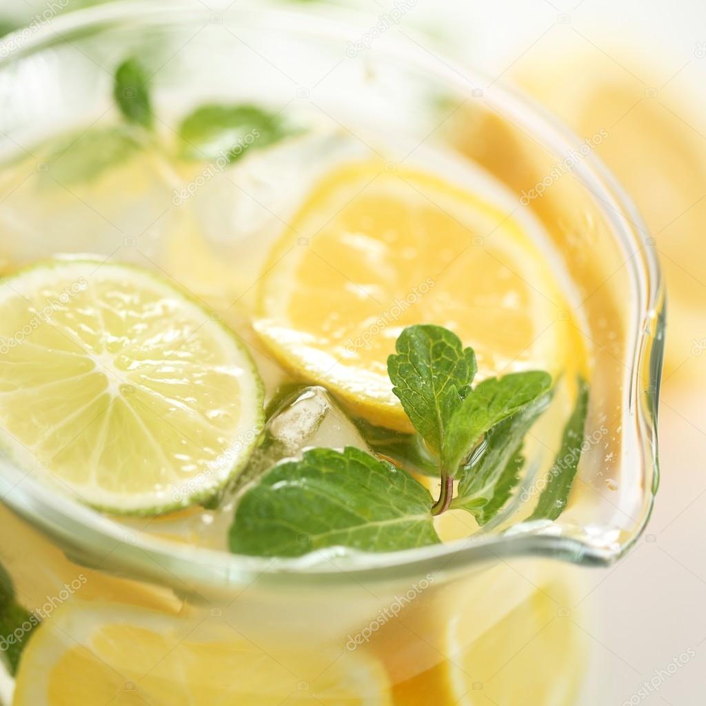 Glass jug with fresh lemonade.