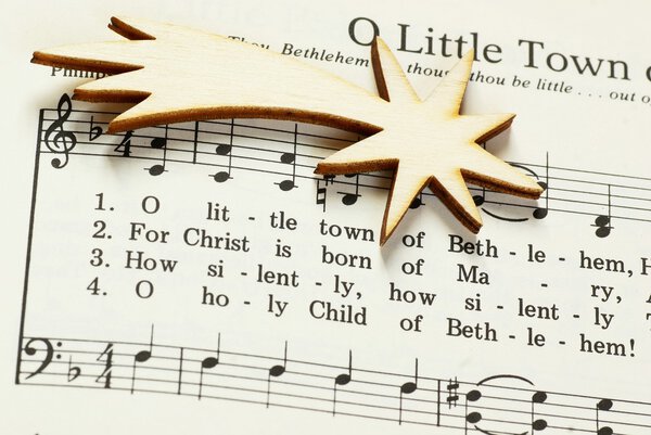 Songbook with Christmas carols and christmas decoration.