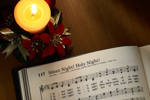 Songbook with christmas carols and christmas decorations.