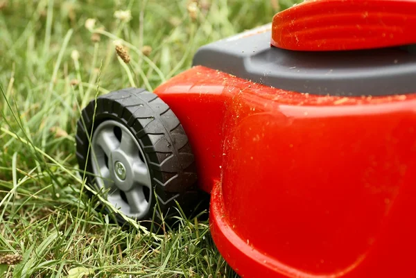 Detail of red cutting machine on grass. — Stock Photo, Image