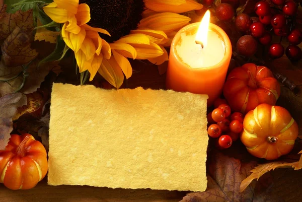 Arrangement of sunflower, candle and autumn decorations — Stock Photo, Image